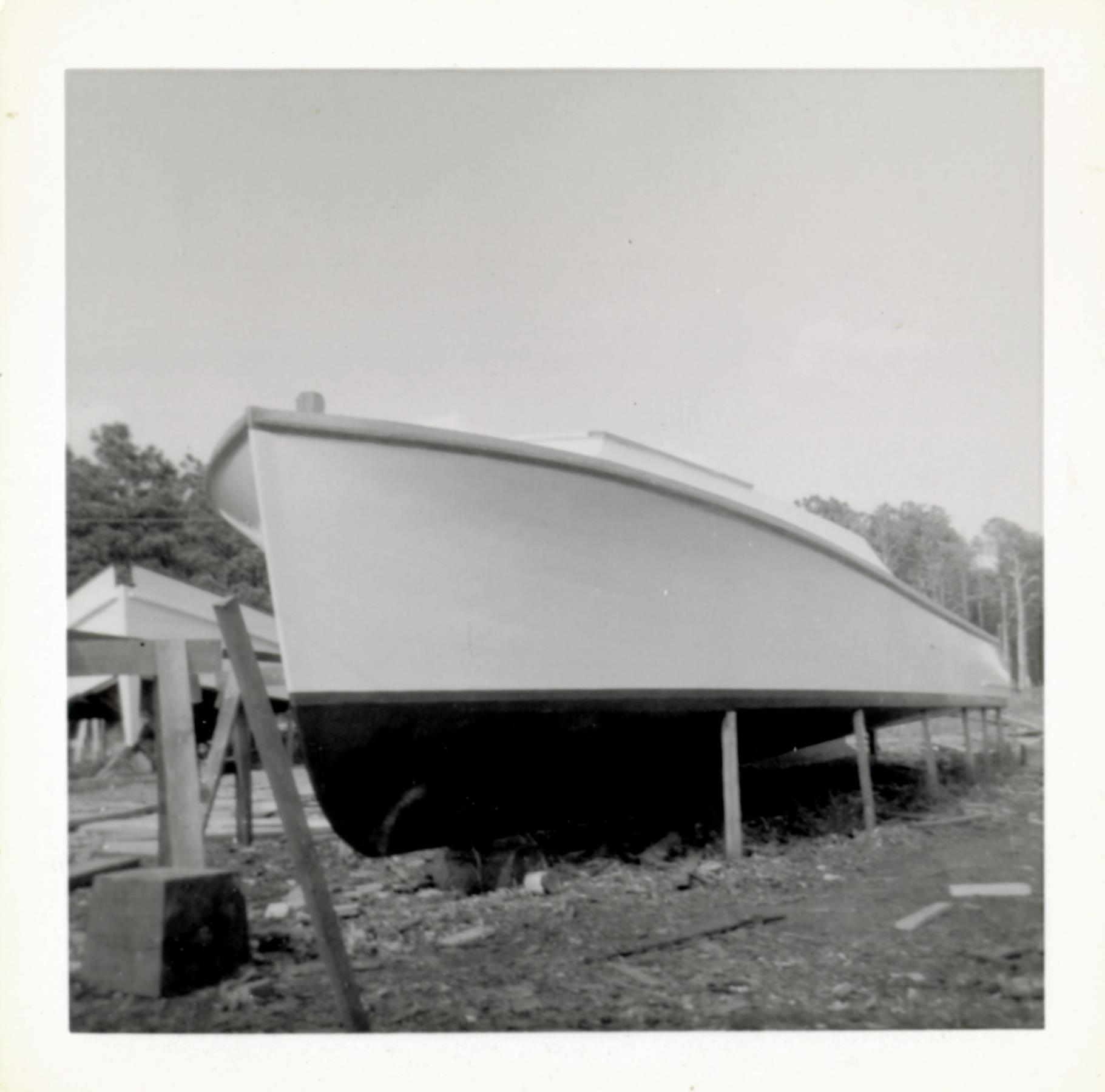 Probably a power cruiser near completion. Vessel in the background is probably the Lady Katie, which was built on a later schedule than the other two of the "Three Sisters" skipjacks. August 1956.