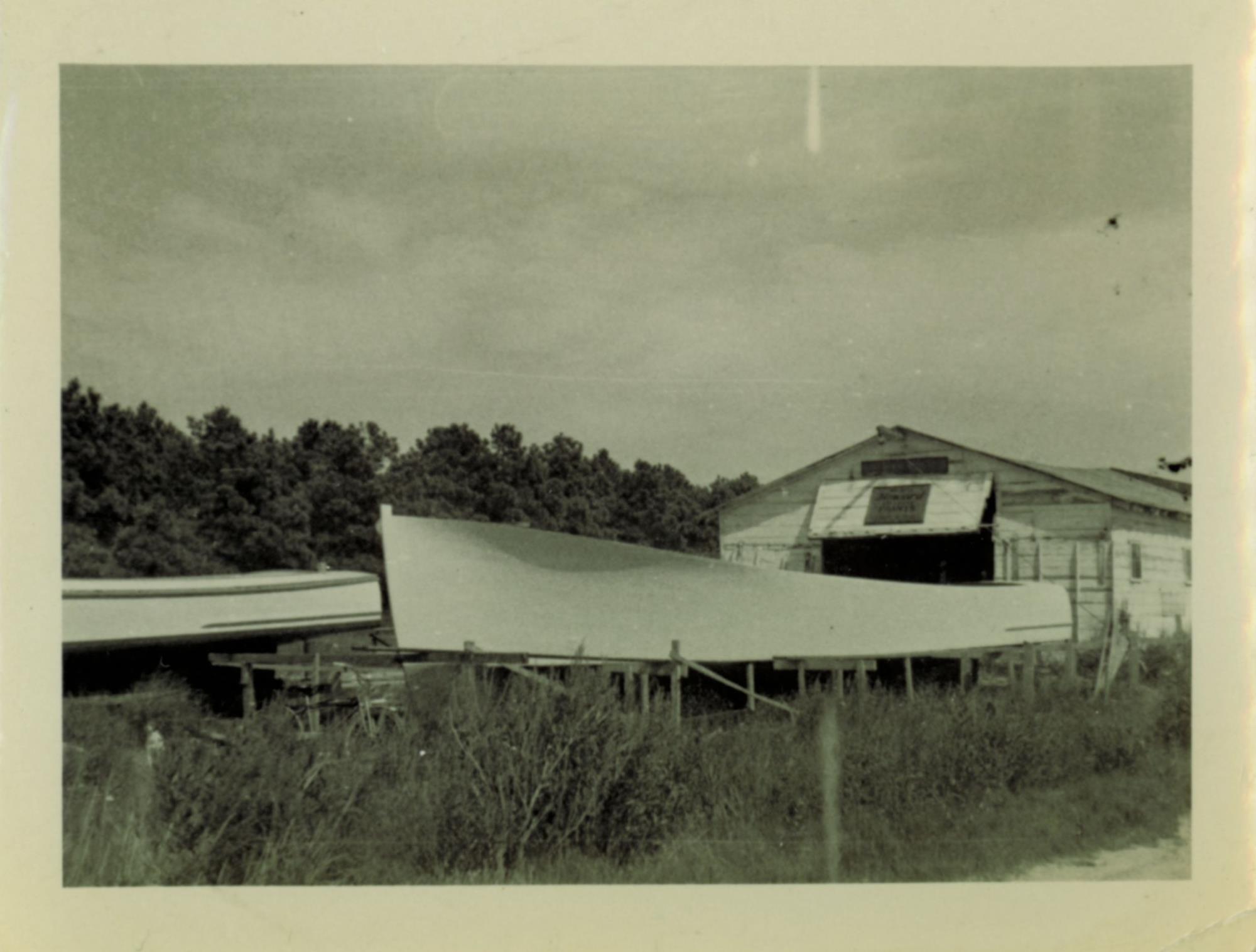 Shed with deadrise workboats under construction. Undated.