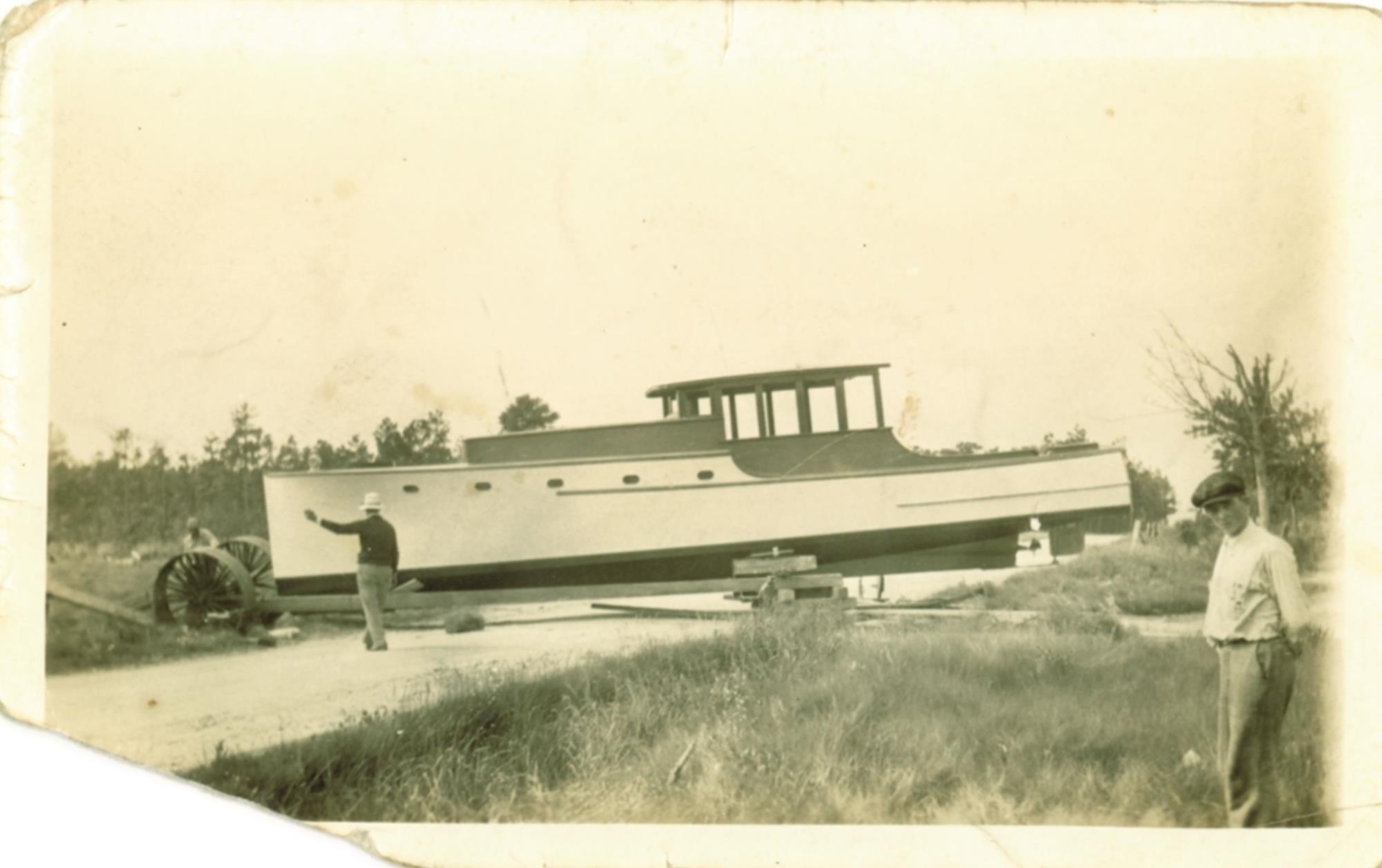 An early photo of launch of a large cabin cruiser shows the wheeled rig like the one used to move skipjacks. Undated, possibly before 1950.