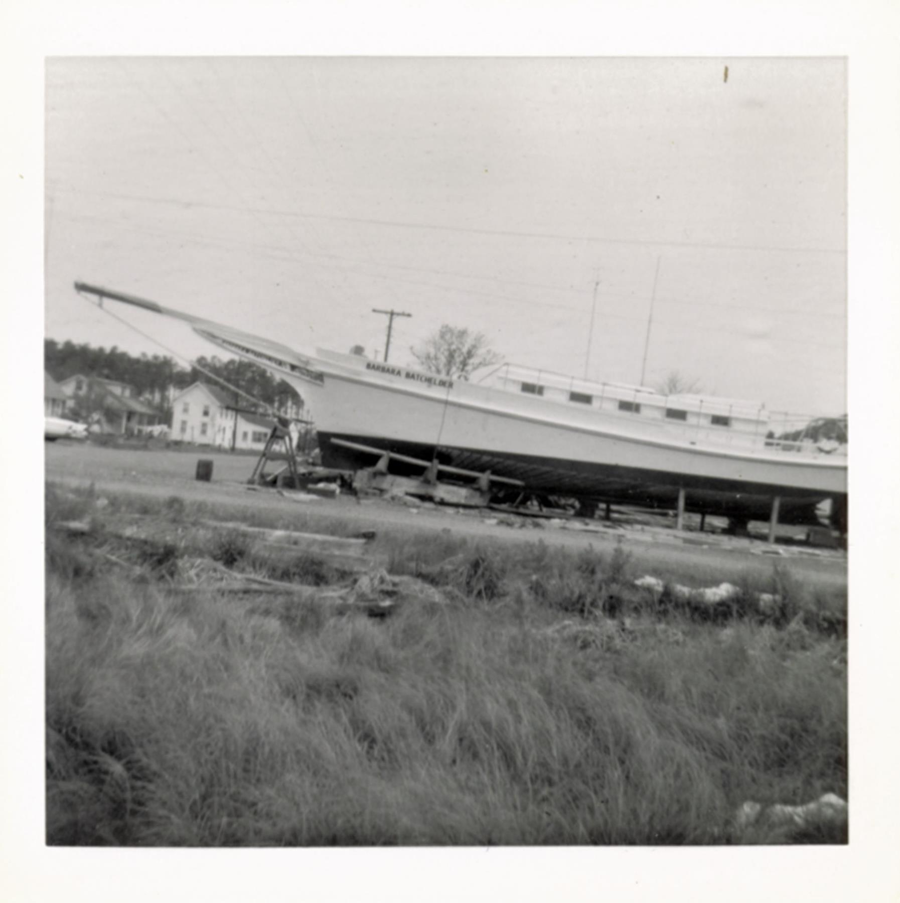 The Du Ponts' skipjack yacht Barbara Batchelder in Bronza's boatyard, forward launch cracle in place. Autumn 1955 or spring 1956.