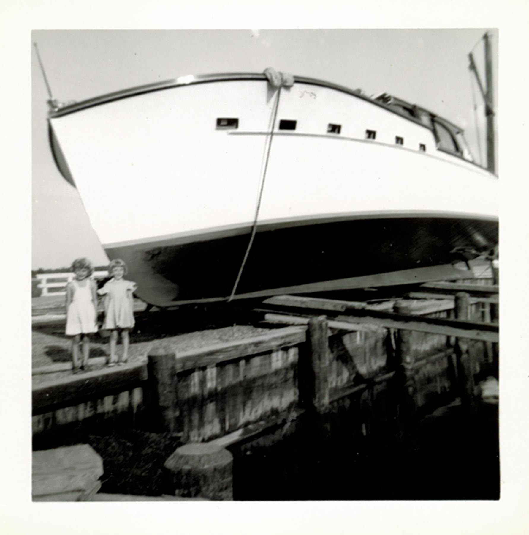 Probably two of Bronza's grandaughters pose for launch. Undated, probably 1955-56.