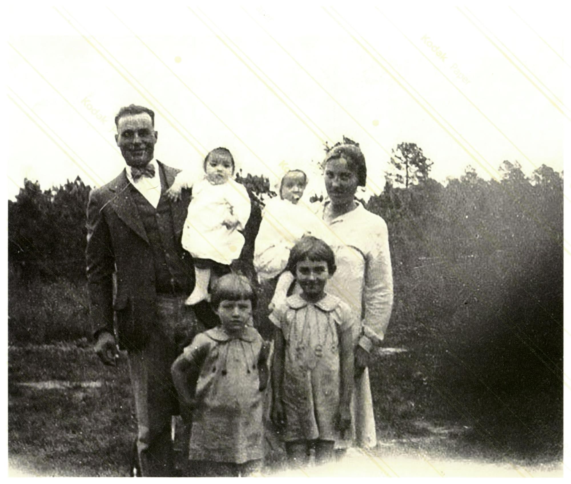 Bronza holding daughter Mary. His wife Katie holding daughter Martha. In front are daughters Irene and Lucille. No date, no place.