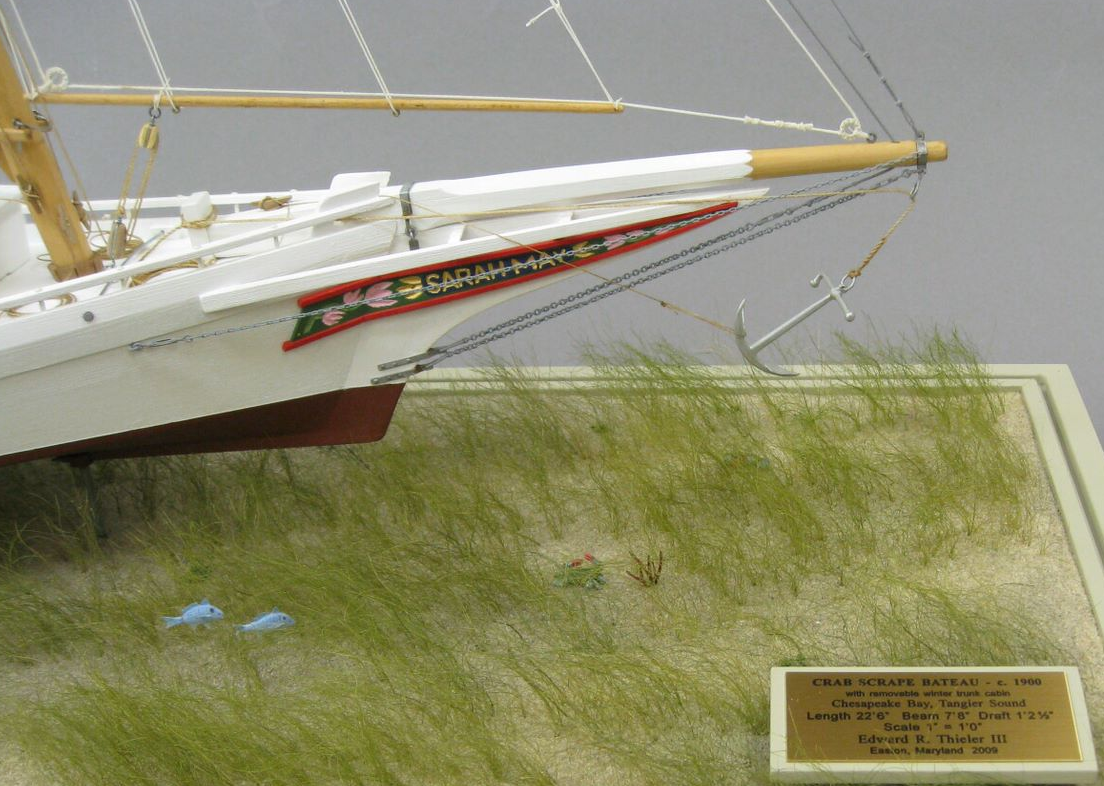 Grasses, fish, crabs , and red-beard sponge, represent the environment in which these scrape-boats and their waterman captains operate .