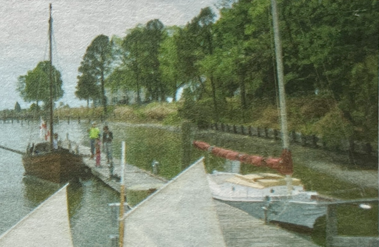 Newspaper clipping shows Blue Crab in the right background at Deltaville Maritime Museum, May 2012.