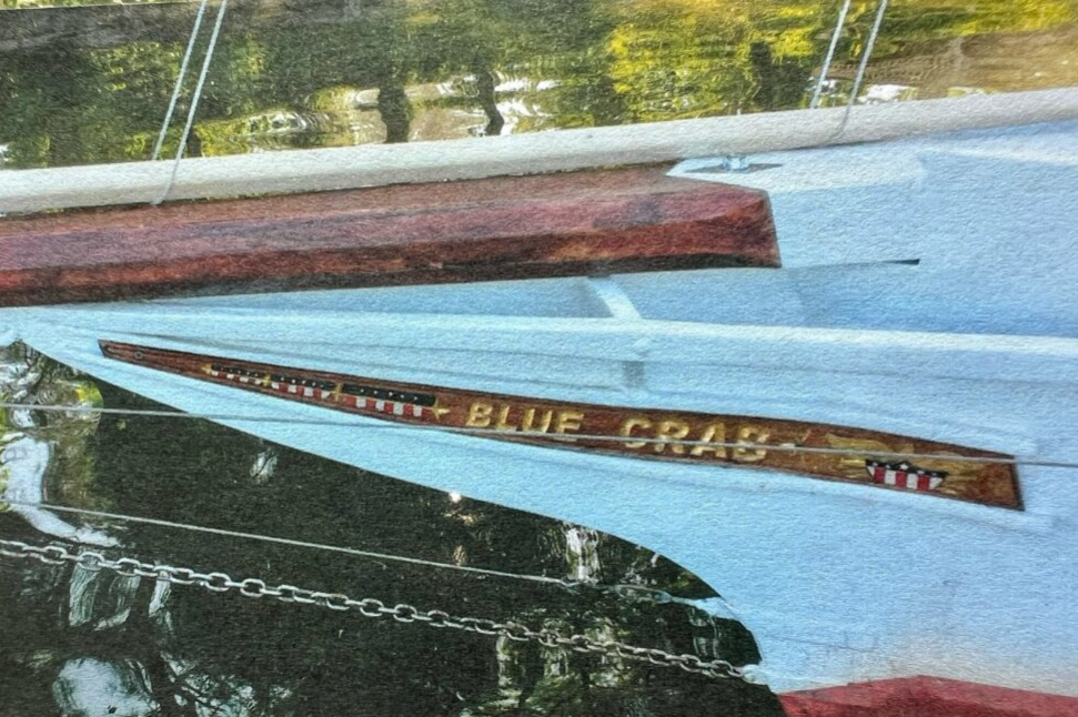New trailboards crafted by Stephens C. “Kaptain Krunch” Smith IV at Deltaville restored Blue Crab to her design name.
