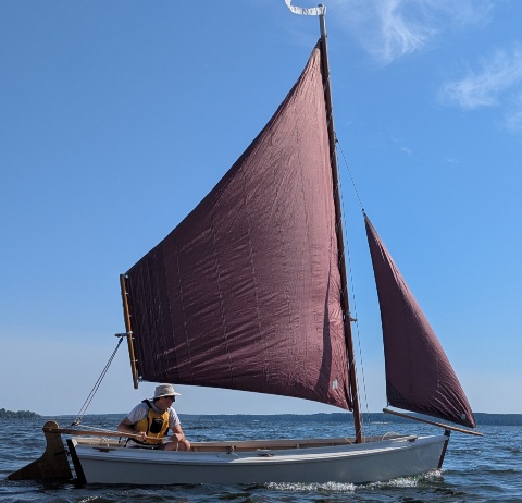 The Chesapeake flattie Opal was built by Chesapeake Bay Maritime Museum shipyard apprentices circa 1995 from the "Uncle Gabe's Flattie" design